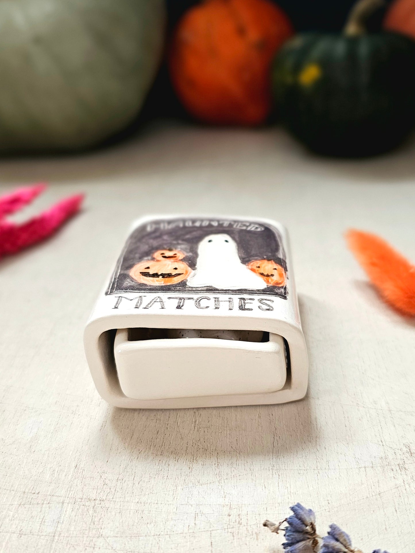 The haunted small ceramic matchbox with mini ghost