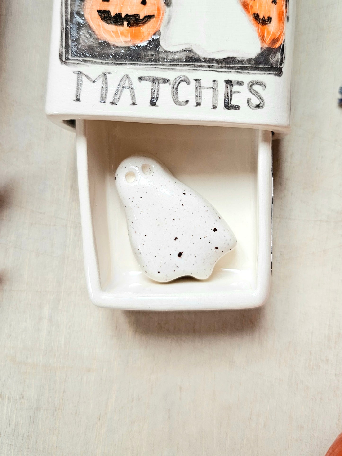 The haunted small ceramic matchbox with mini ghost