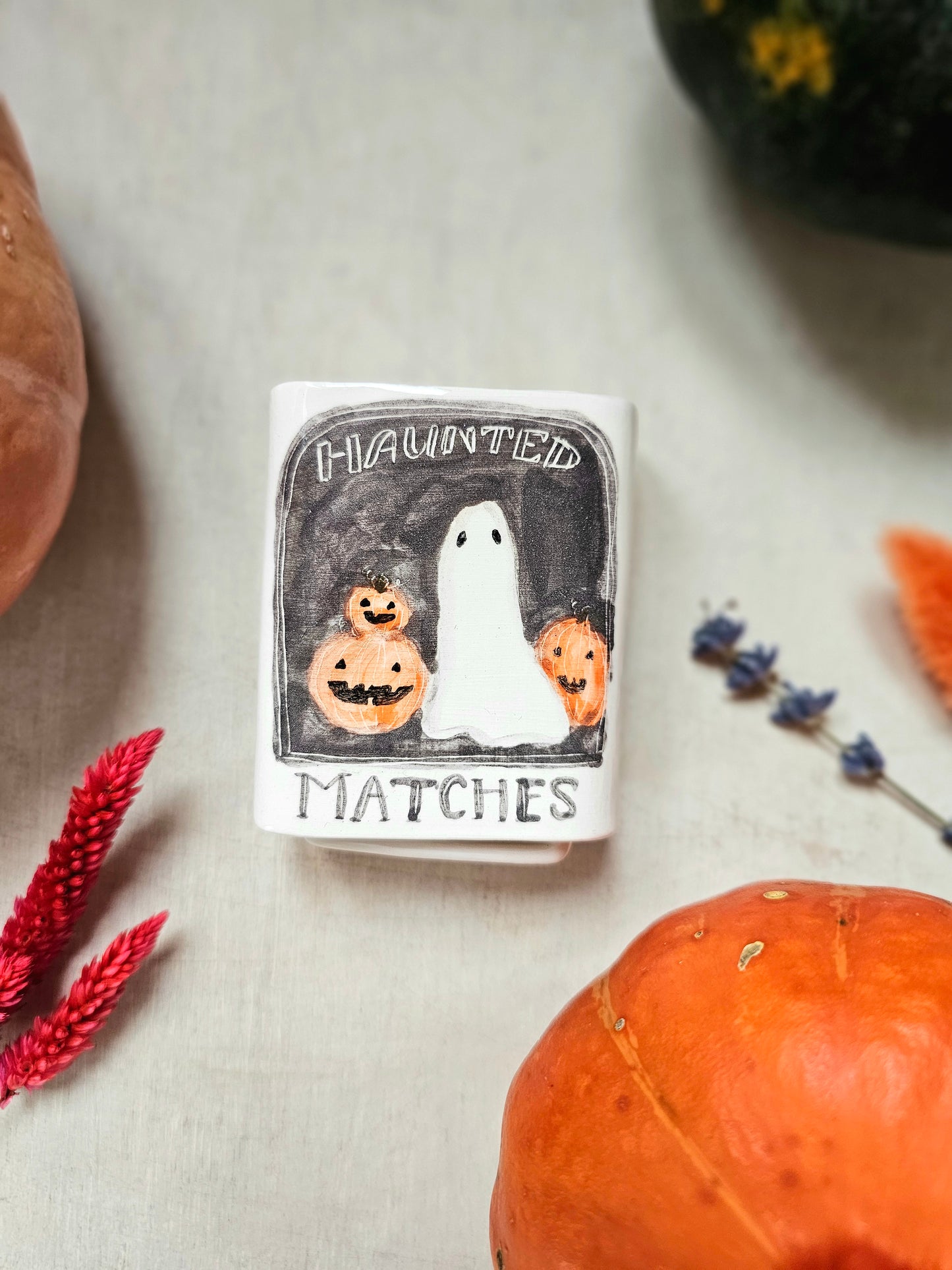 The haunted small ceramic matchbox with mini ghost