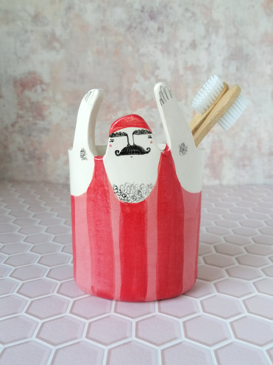 Hector the strongman ceramic toothbrush holder