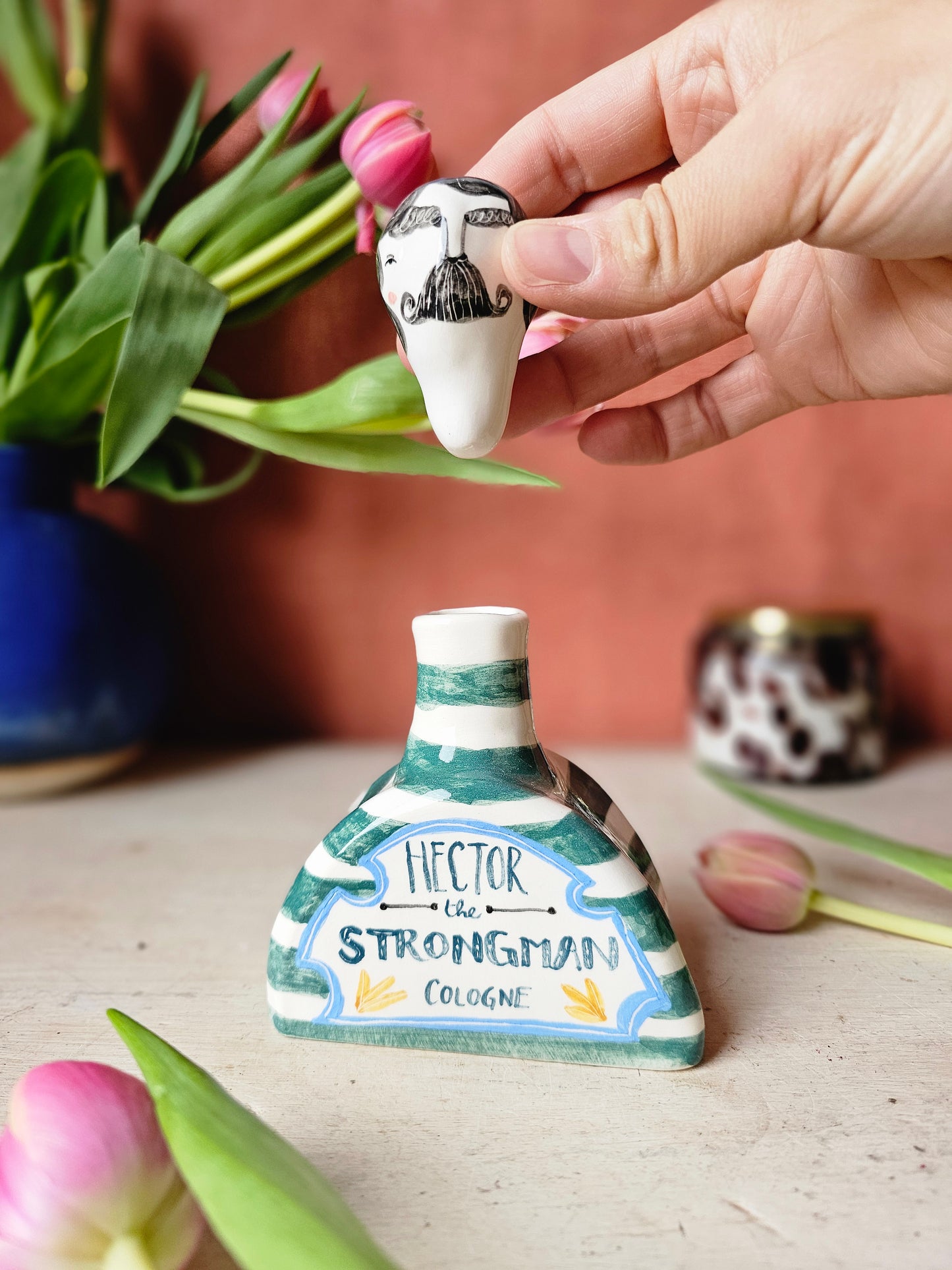 Hector the Strongman cologne Bottle